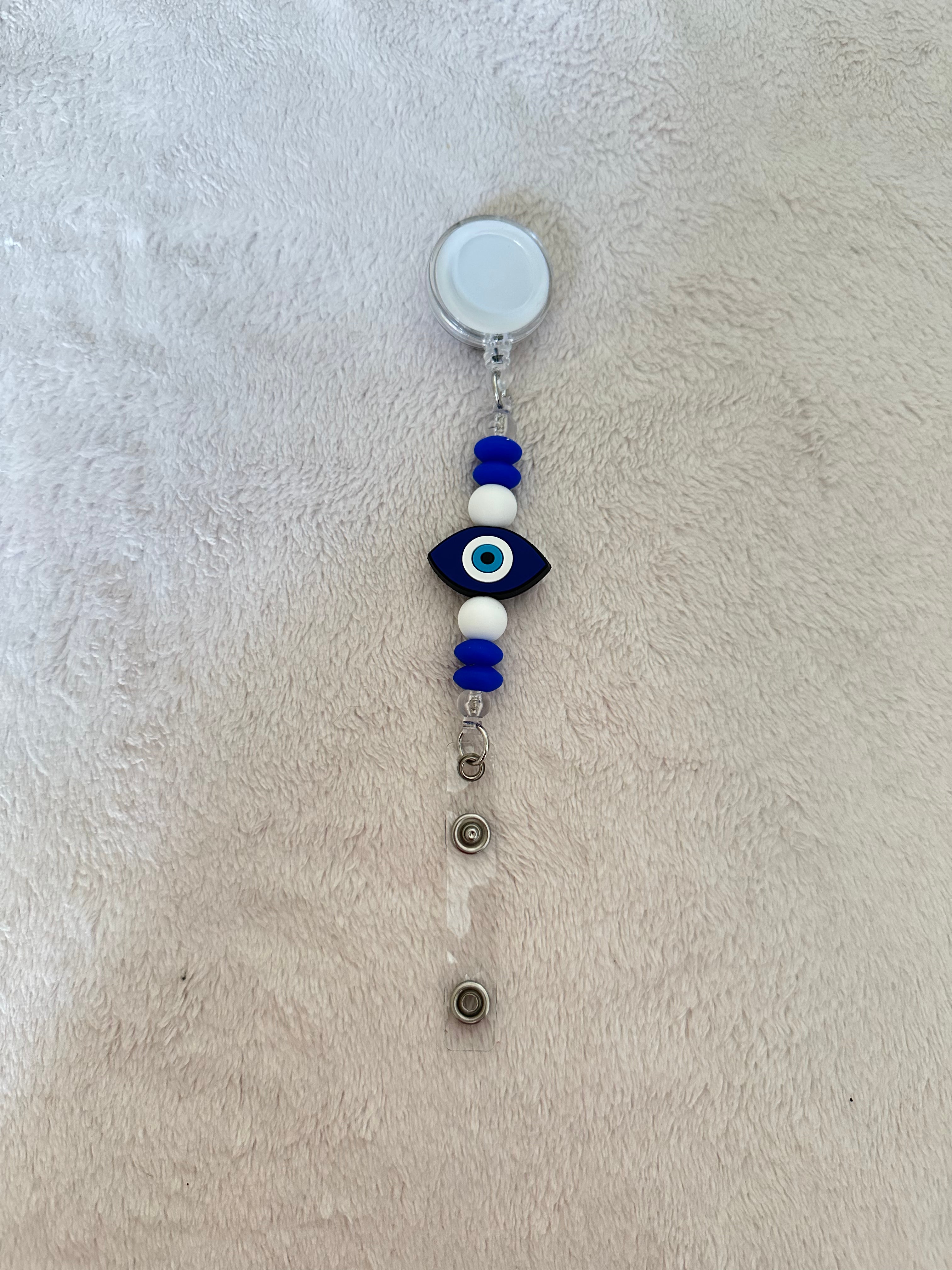 Evil eye retractable ID badge