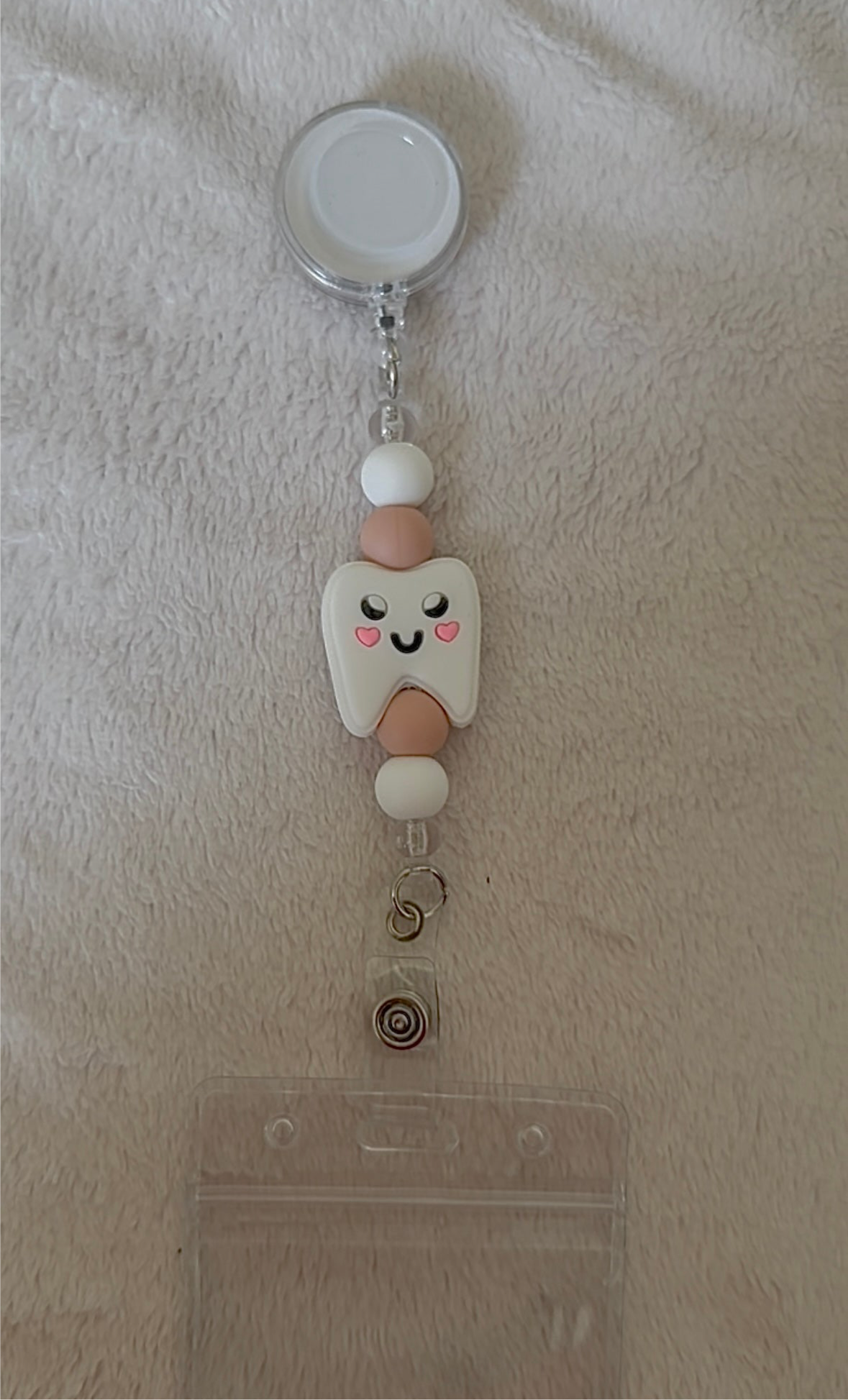 Tooth retractable ID holder