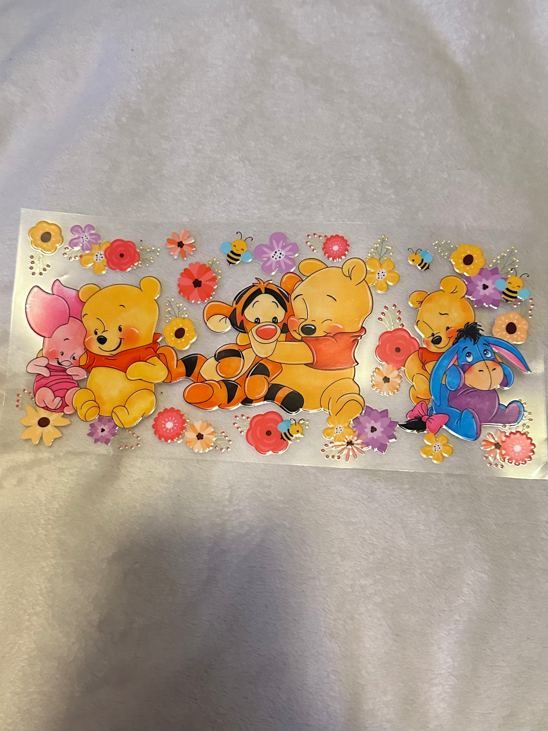 Pooh hugging friends