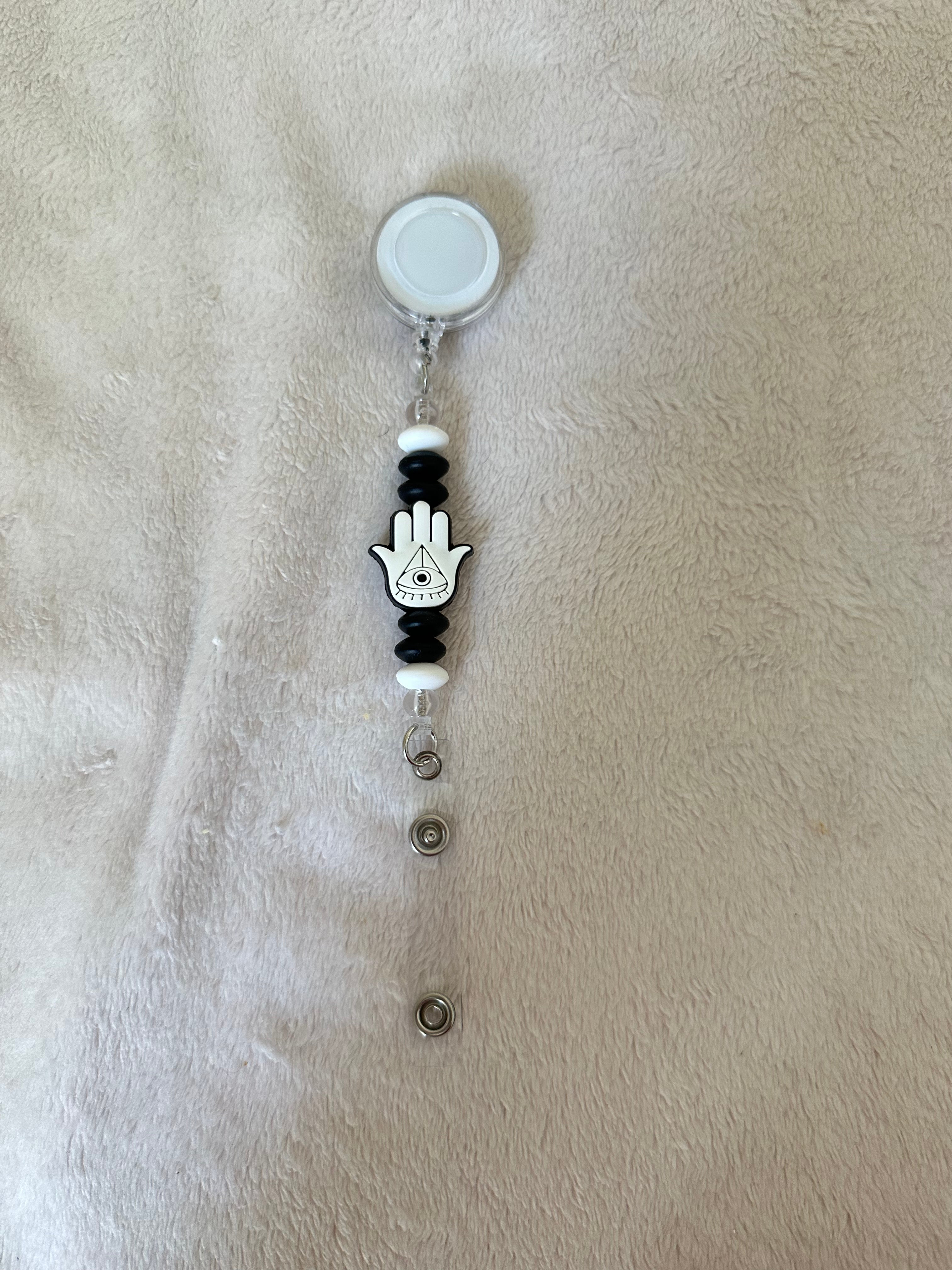 Evil eye retractable ID badge