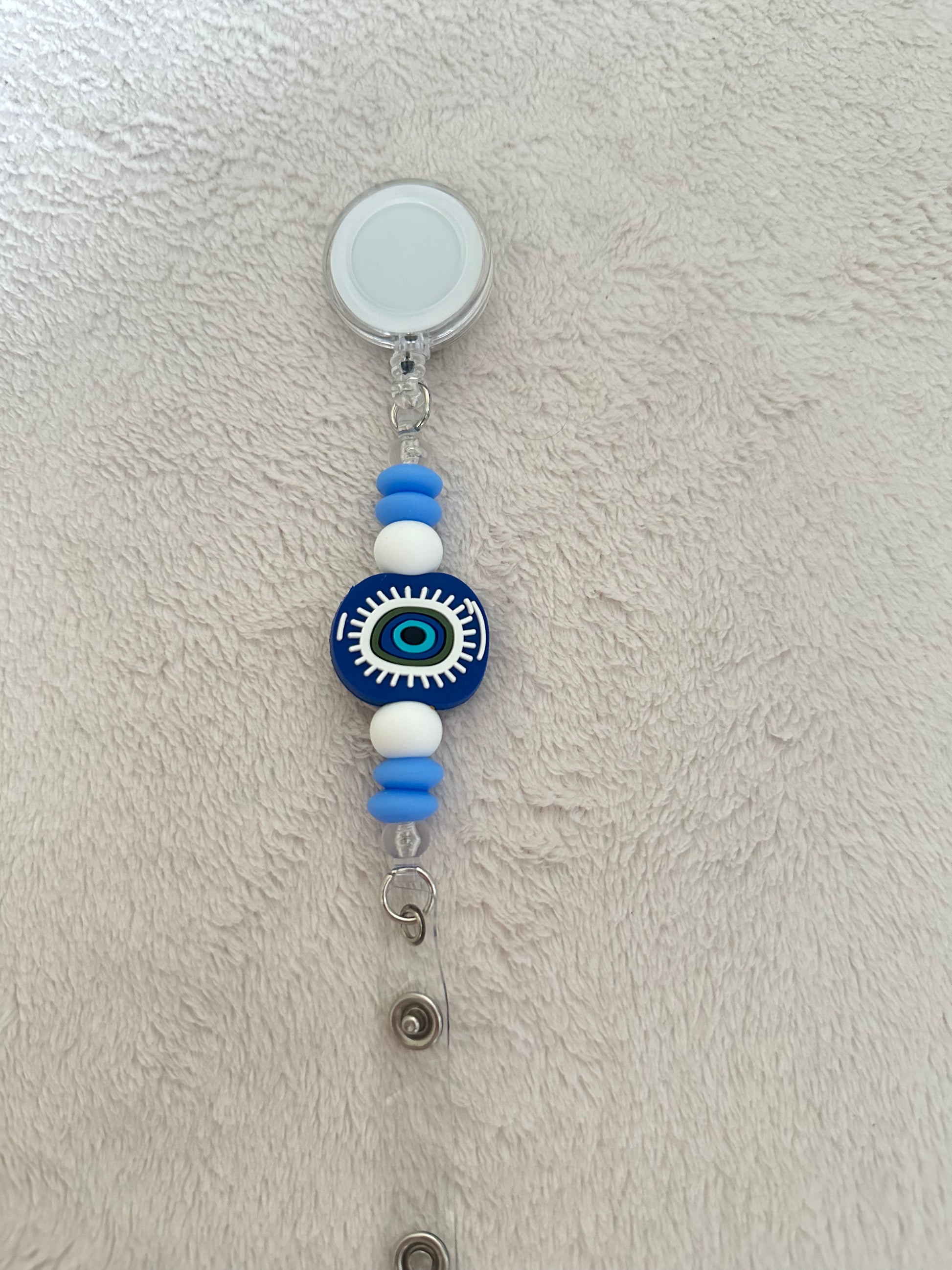 Evil eye retractable ID holder