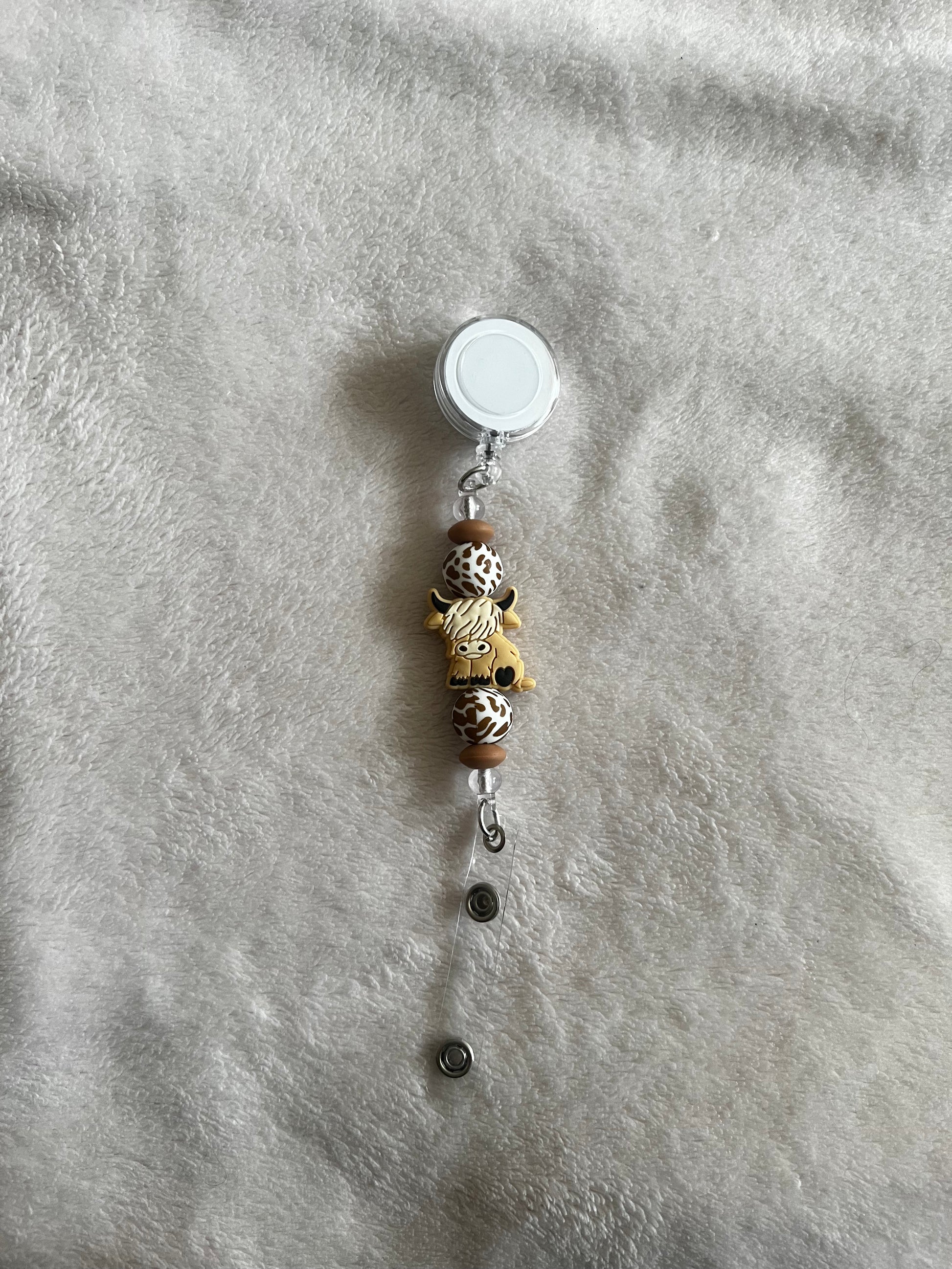 Cow retractable ID holder