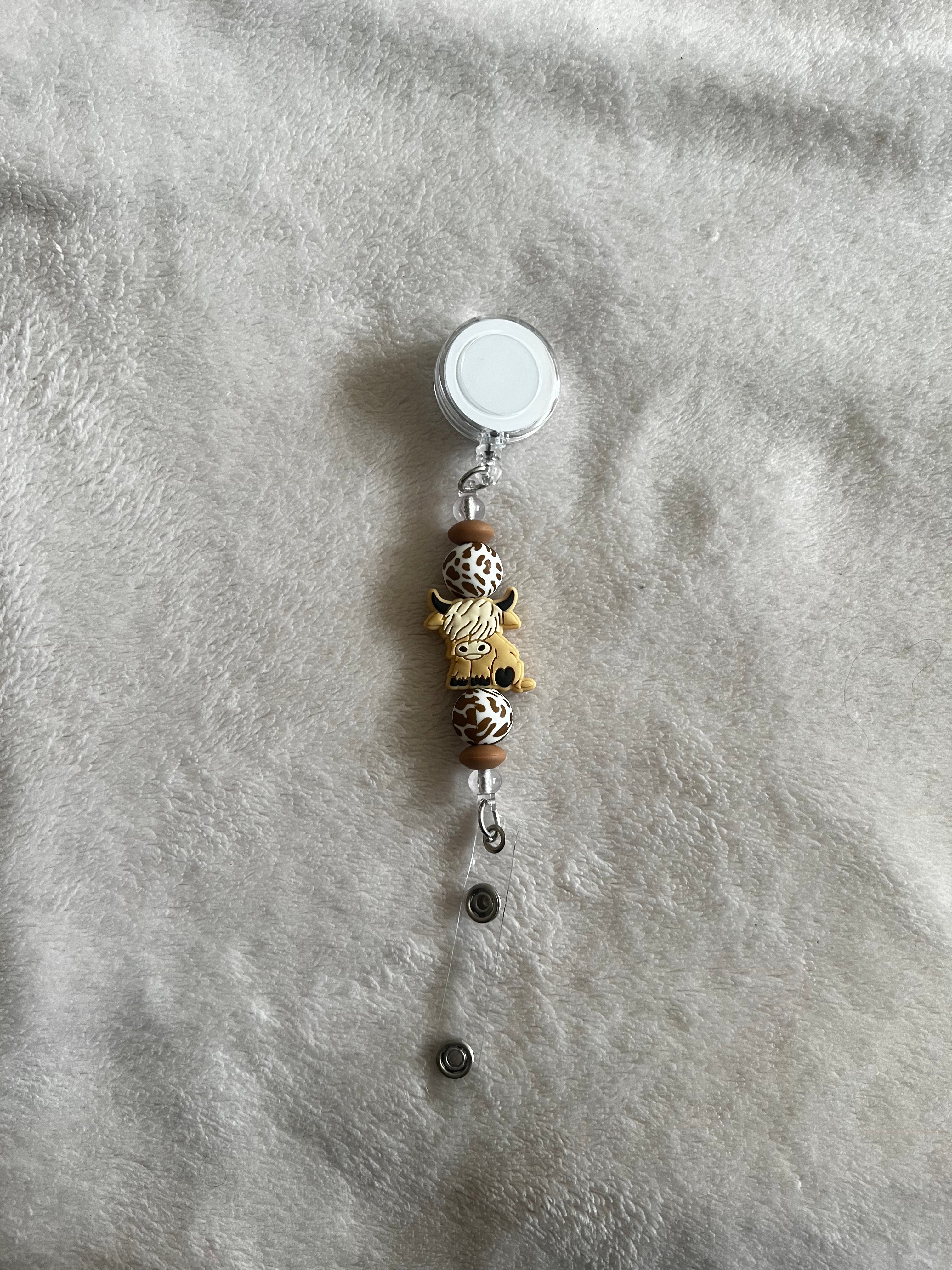 Cow retractable ID holder