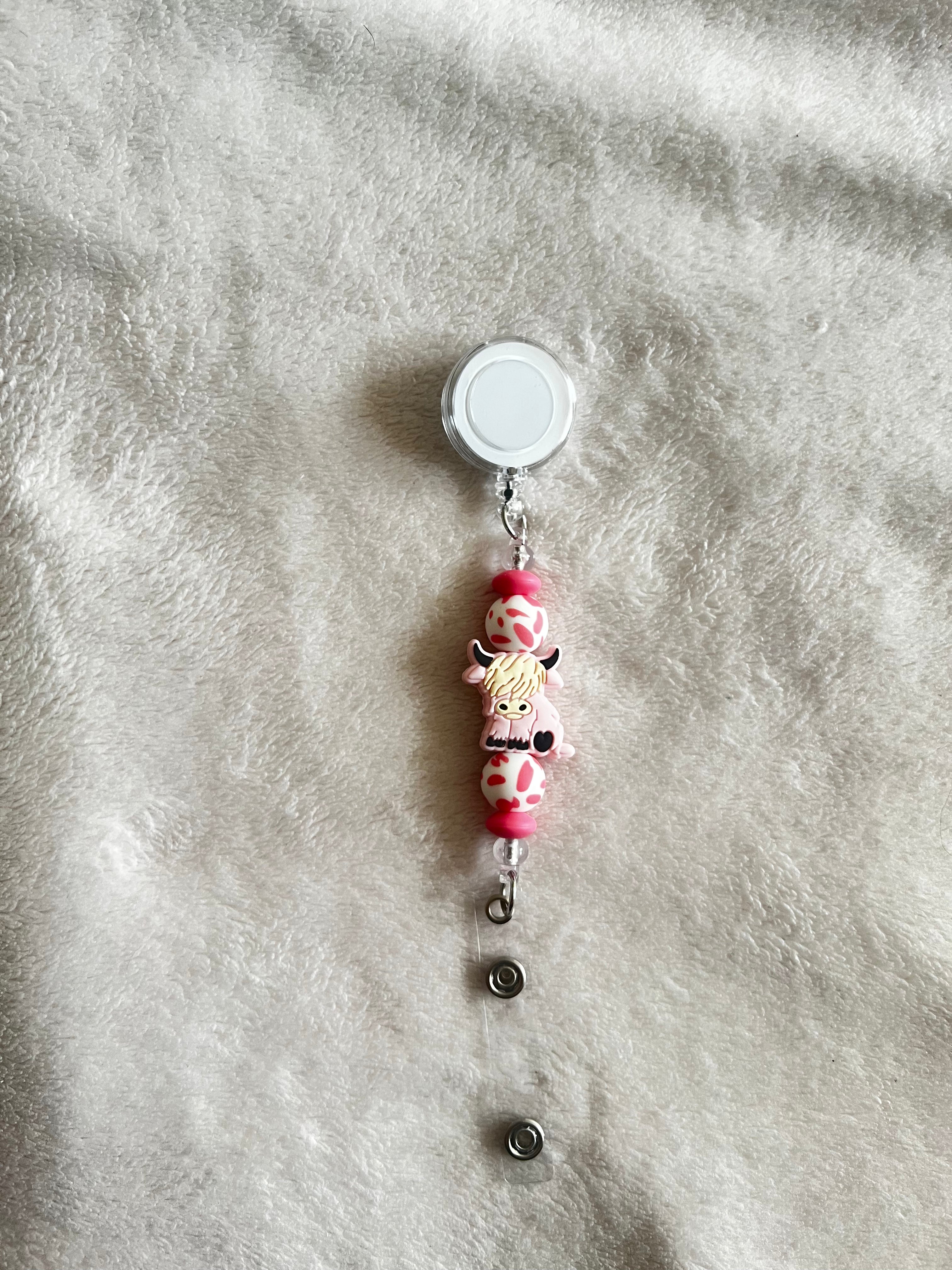 Cow retractable ID holder