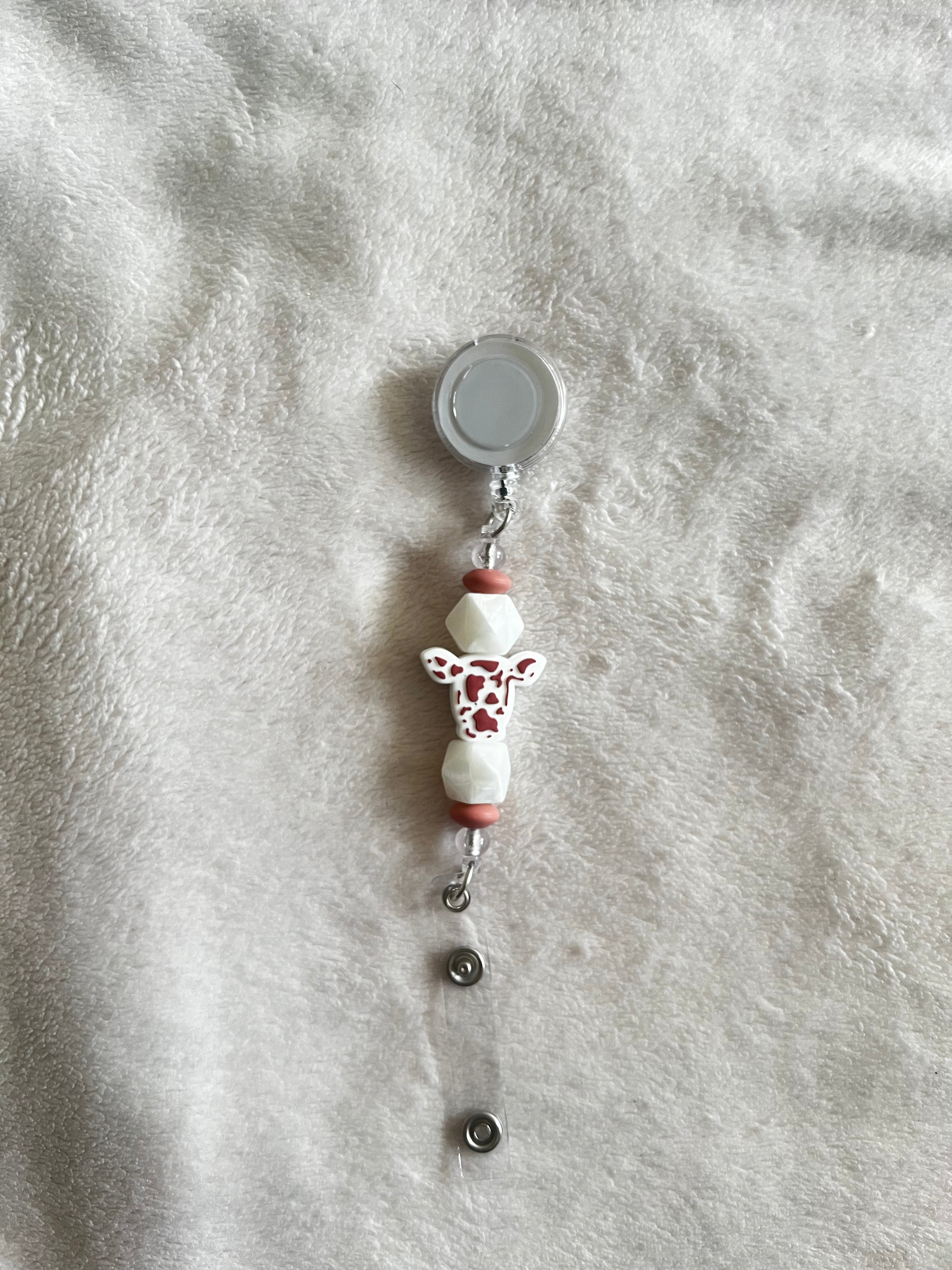 Cow retractable ID holder